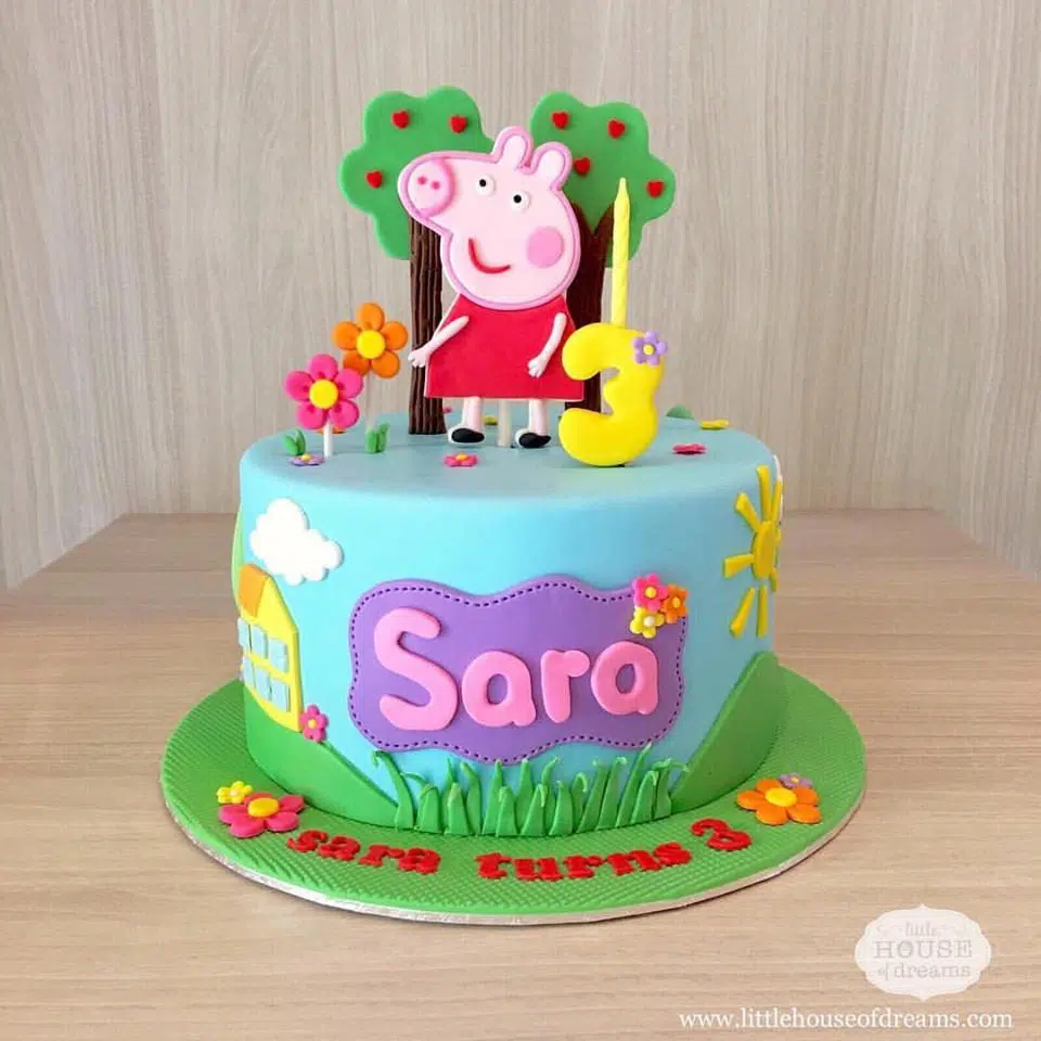 A very pretty and colourful Peppa Pig cake decorated with fondant cutouts. Little House of Dreams.Source