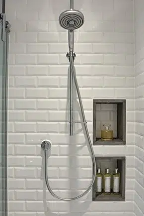 Recessed shower shelf that cleverly incorporates the subway tiles