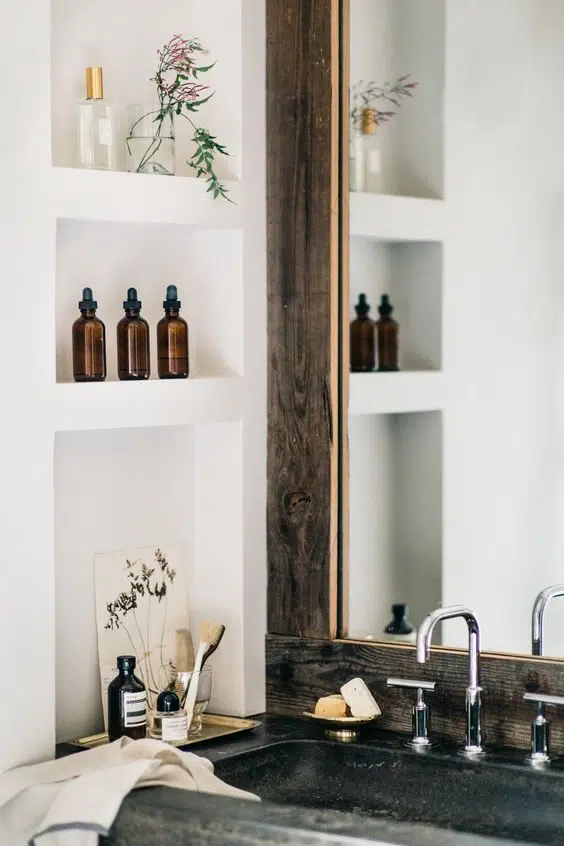 White cubby holes matched with distressed wood mirror frame