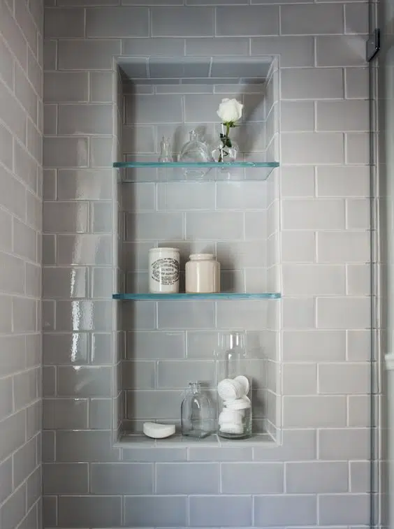 Glass shelves built into the shower area