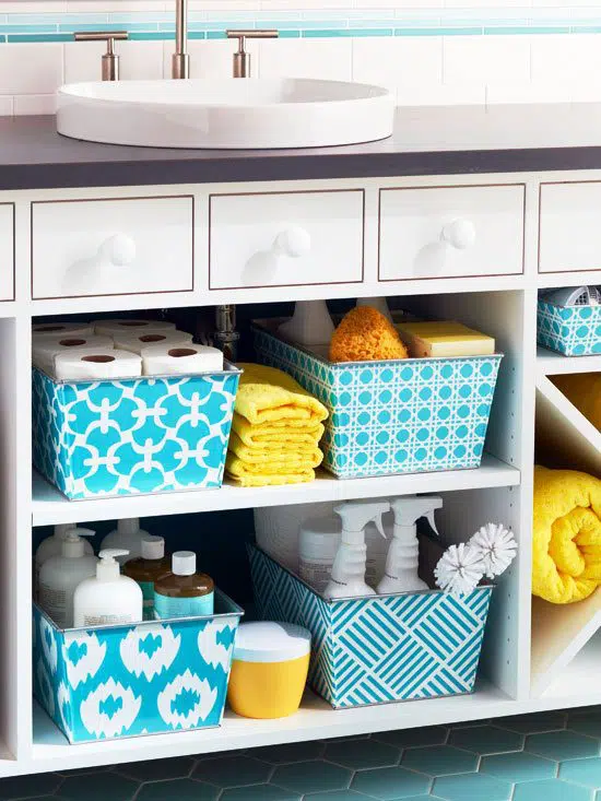 Floating vanity with matching blue floor and wall tiles (even the baskets are perfectly coordinated!).