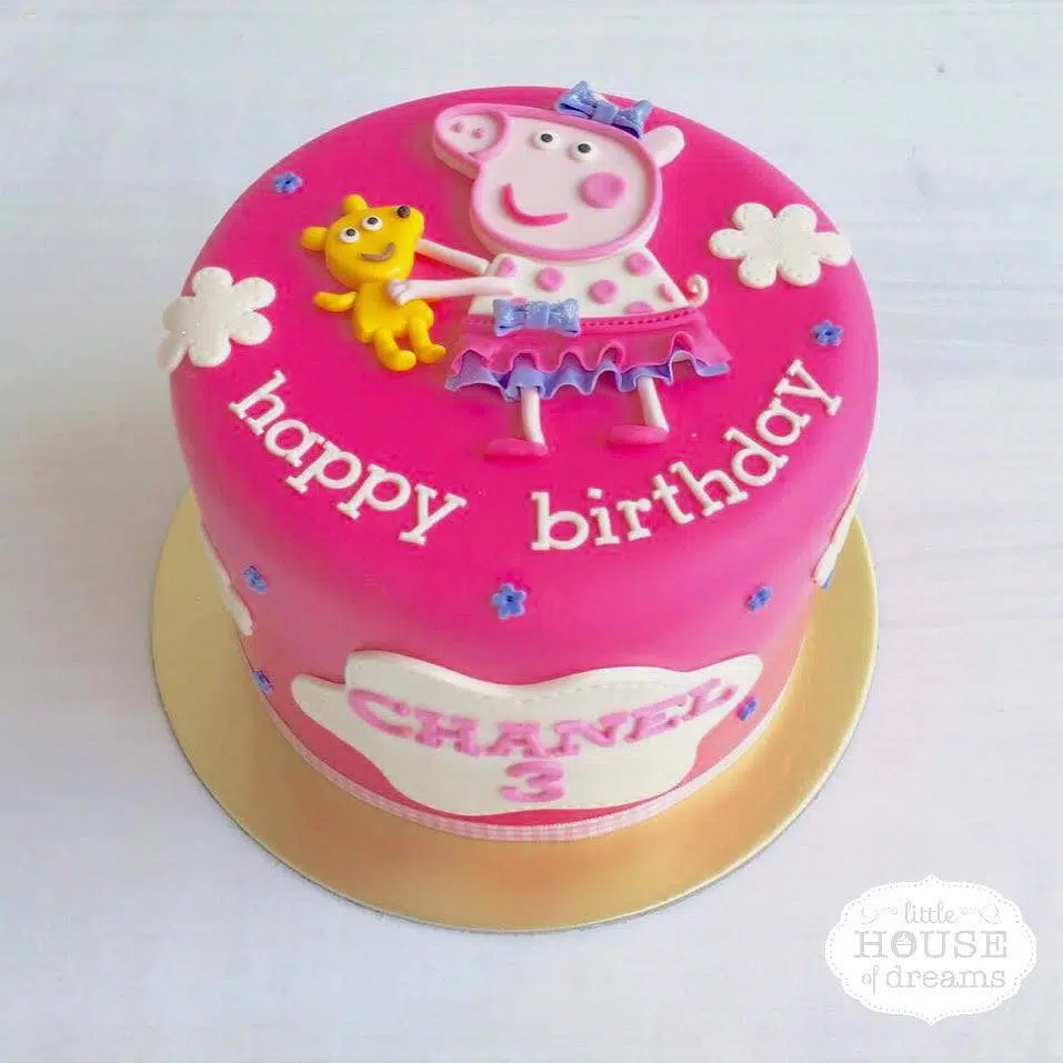 A tall round cake with Peppa Pig all dressed up for your child’s birthday party. Little House of Dreams.Source