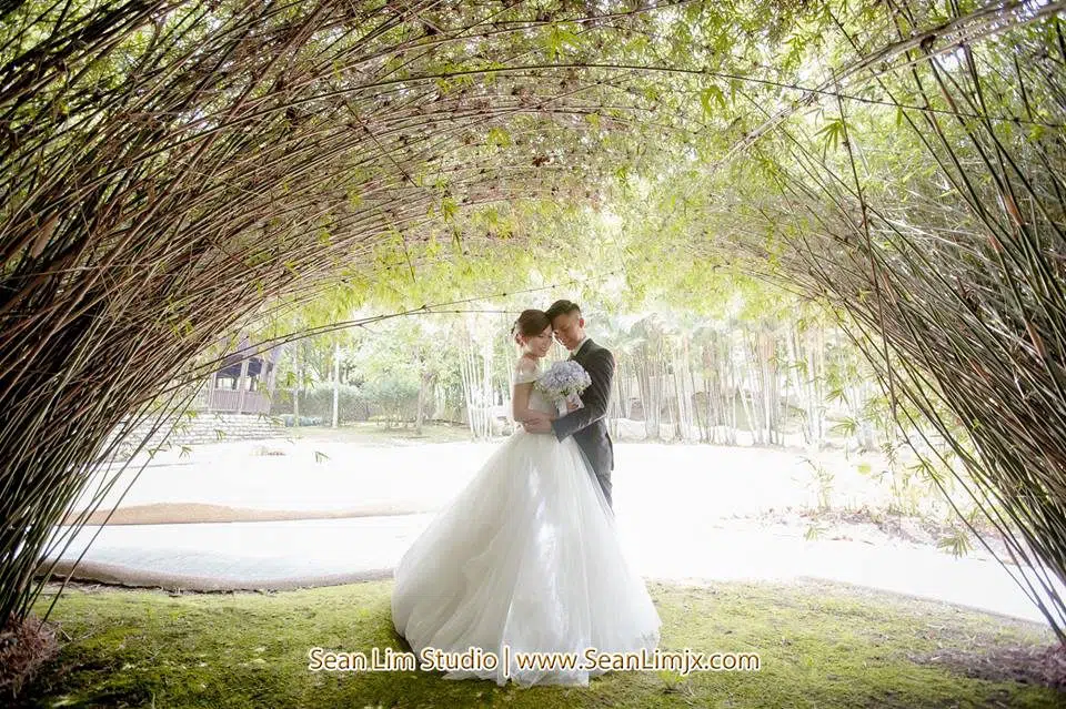 Prewedding photograph under a bamboo canopy in Malaysia by Sean Lim