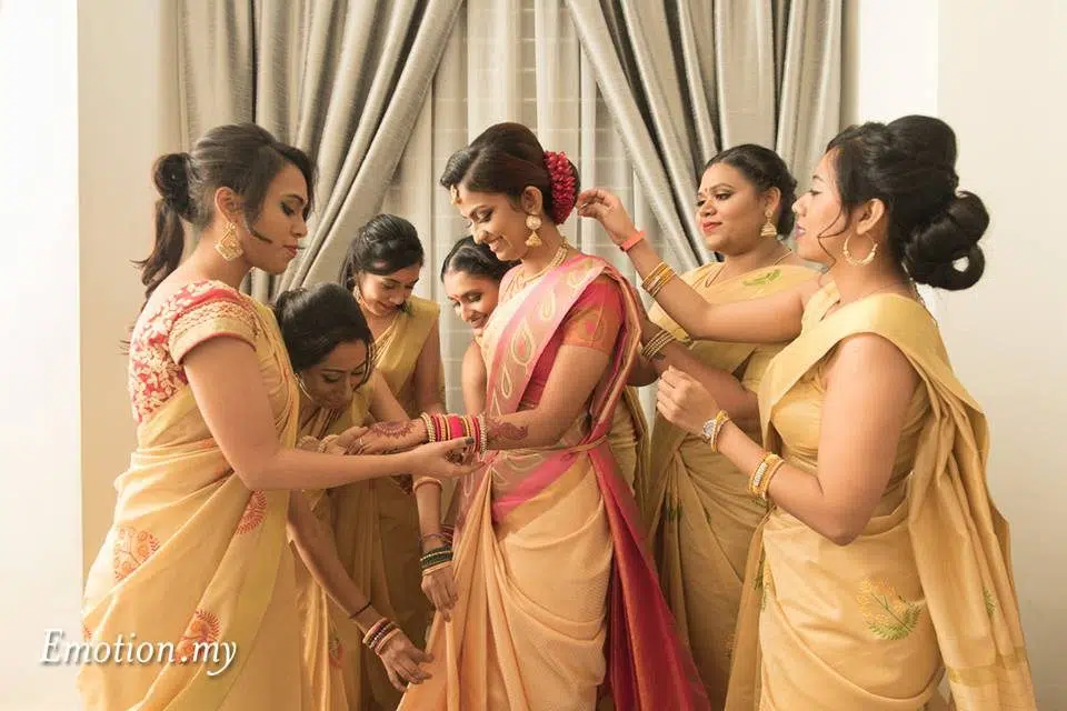 Preparing the bride for traditional Indian wedding in Malaysia. Photo by Emotion in Pictures by Andy Lim