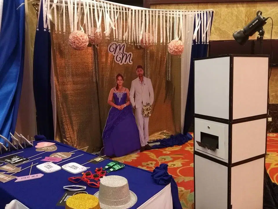 Simple blue and gold wedding photobooth backdrop. You can even add a cardboard cutout of the wedding couple!