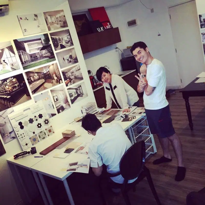 Henry Golding and designers from MIL Design & Construction discussing mood boards