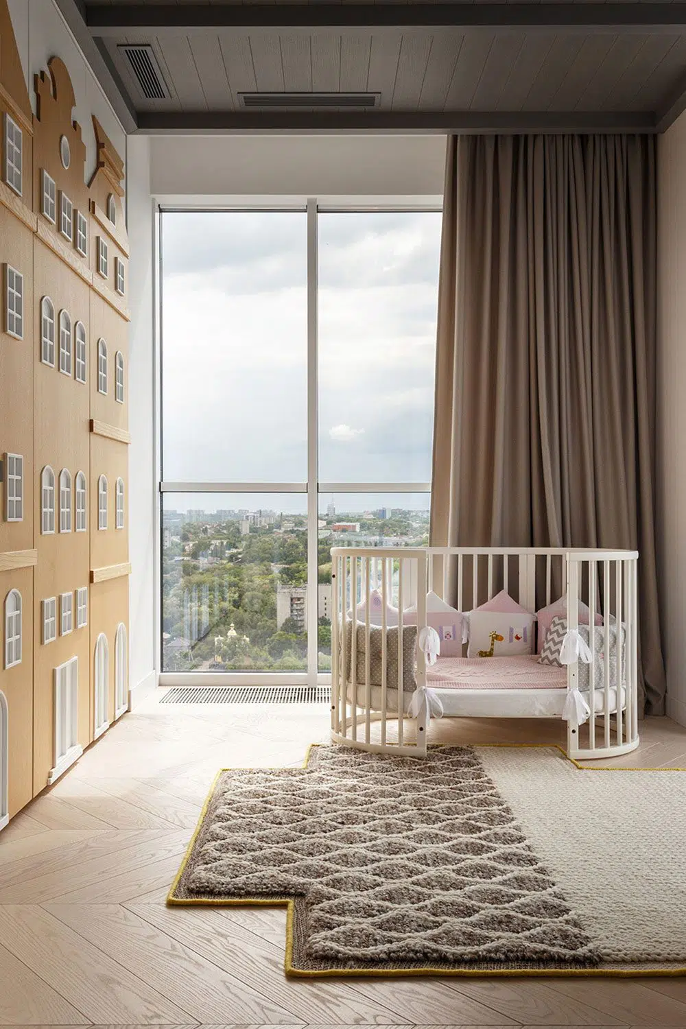 Baby bedroom with wood cutouts on wardrobe door