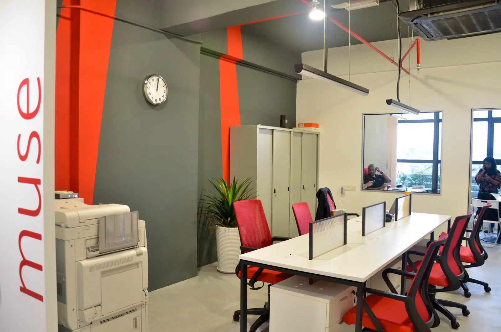 Employee desks with low partitions at the office of Muse Asia. Source: EzyOffice