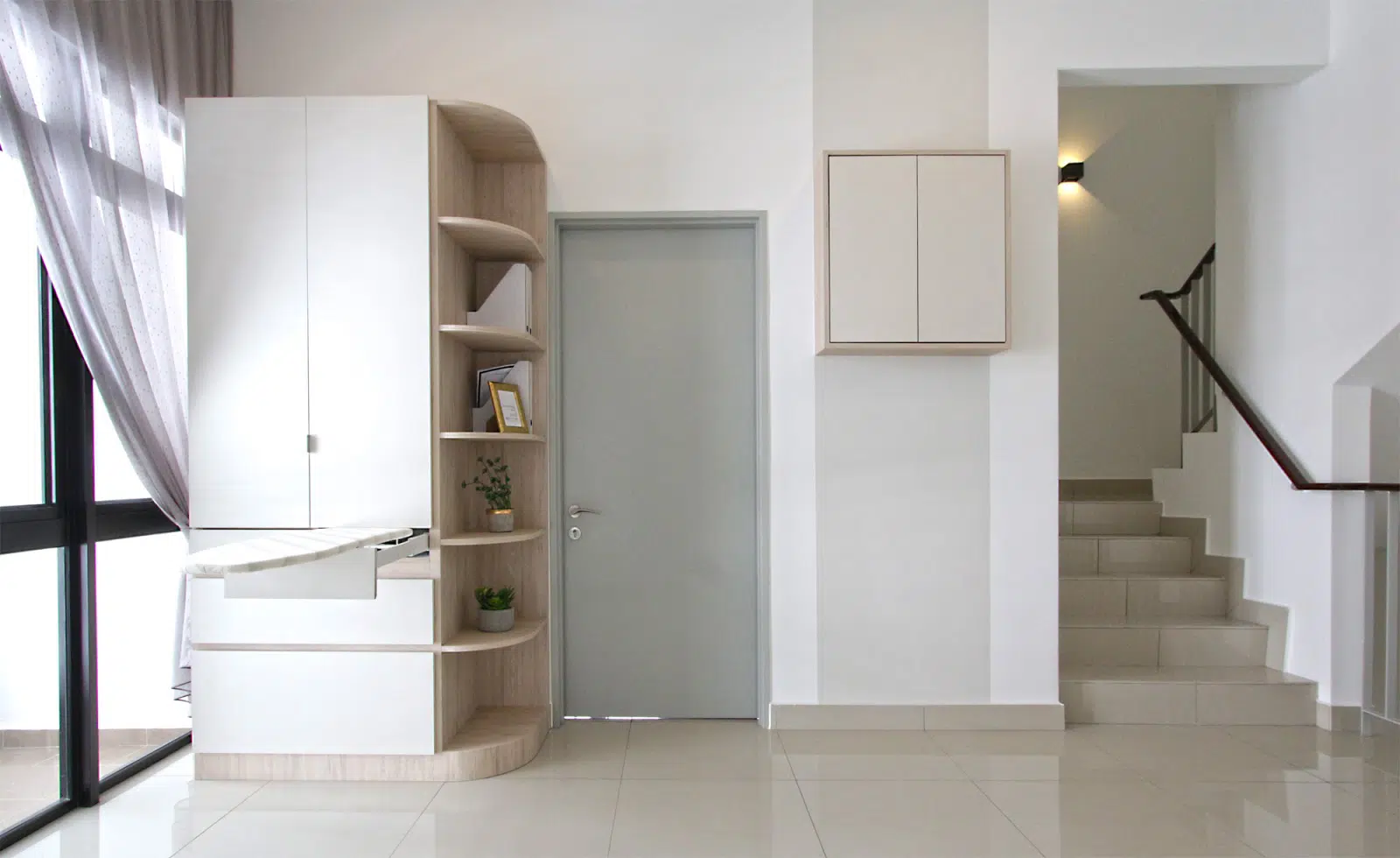 Above: A built-in ironing board with more shelves and cabinets.