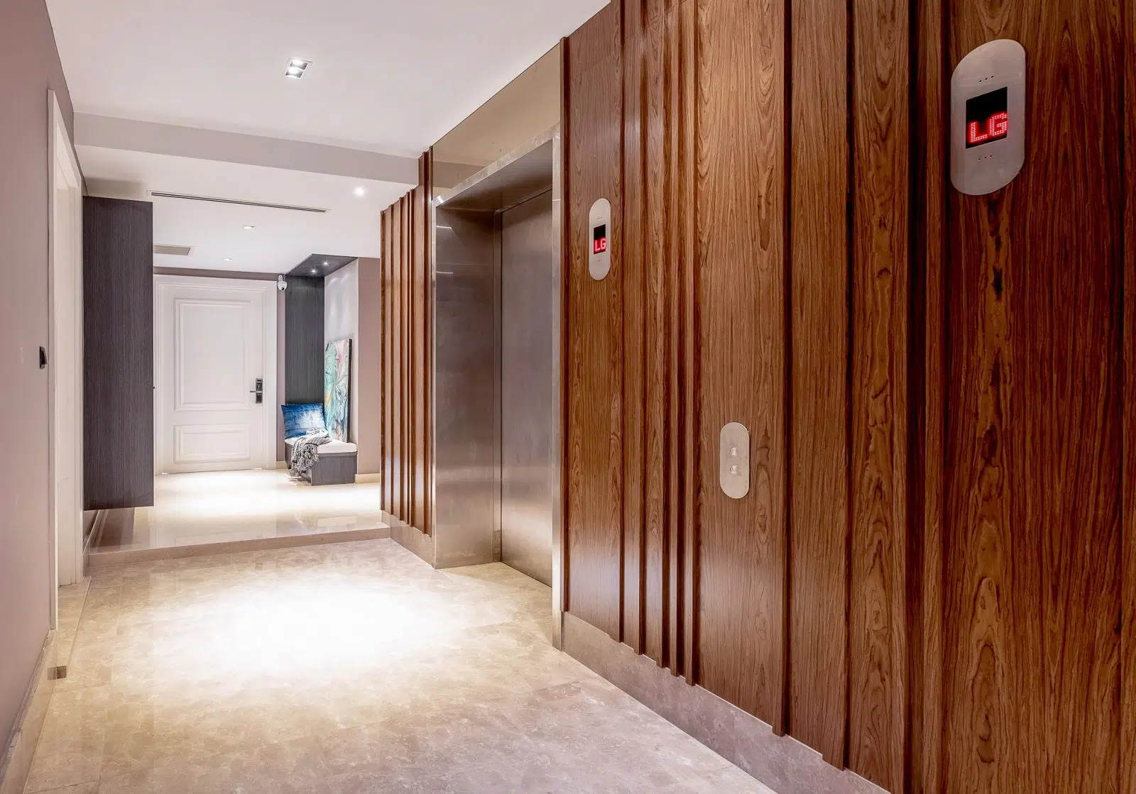 Above: walnut wood wall panels on the personal lift corridor outside.