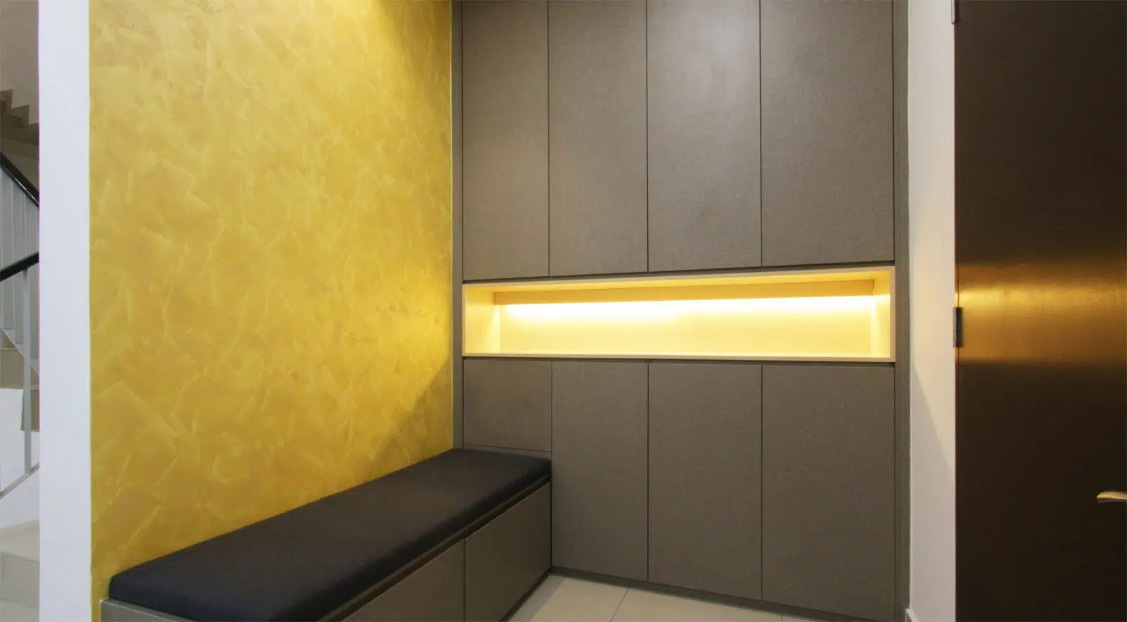 shoe cabinet area with a textured painted wall. Project was done by R.Works in Southville City