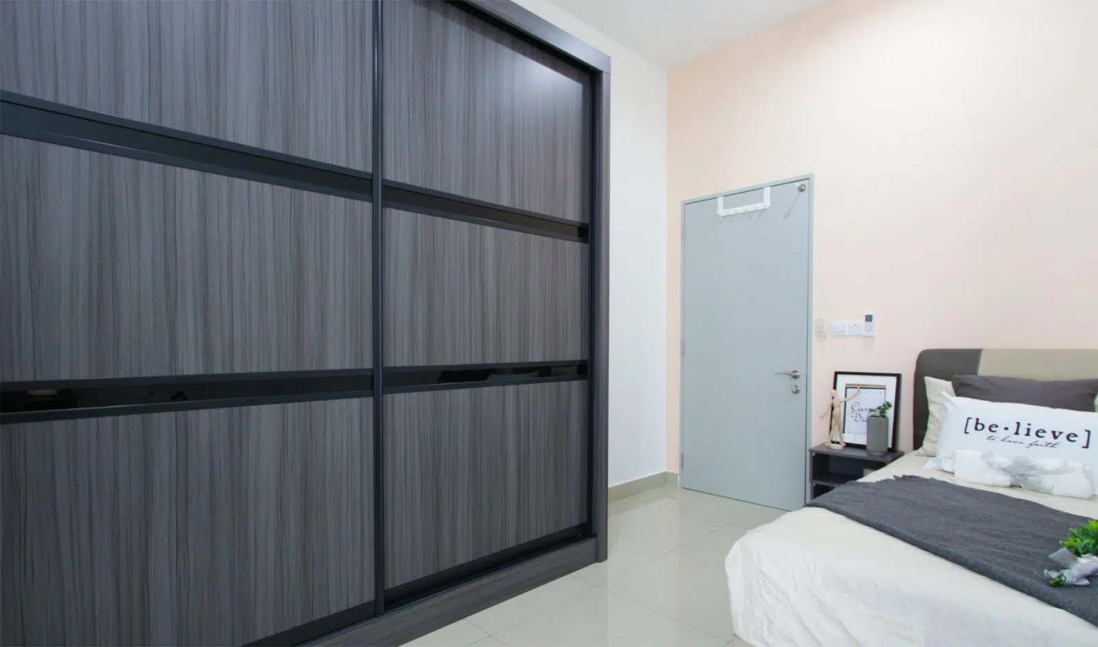 wardrobe design in of the bedrooms of this house in southville city