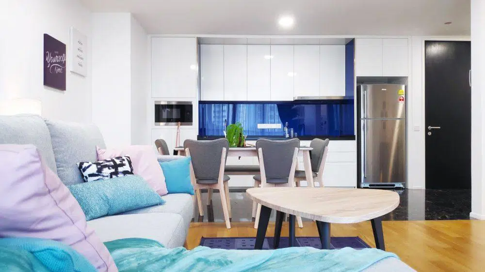 Living room and pantry area in blue and purple at The Arcoris, Mont Kiara