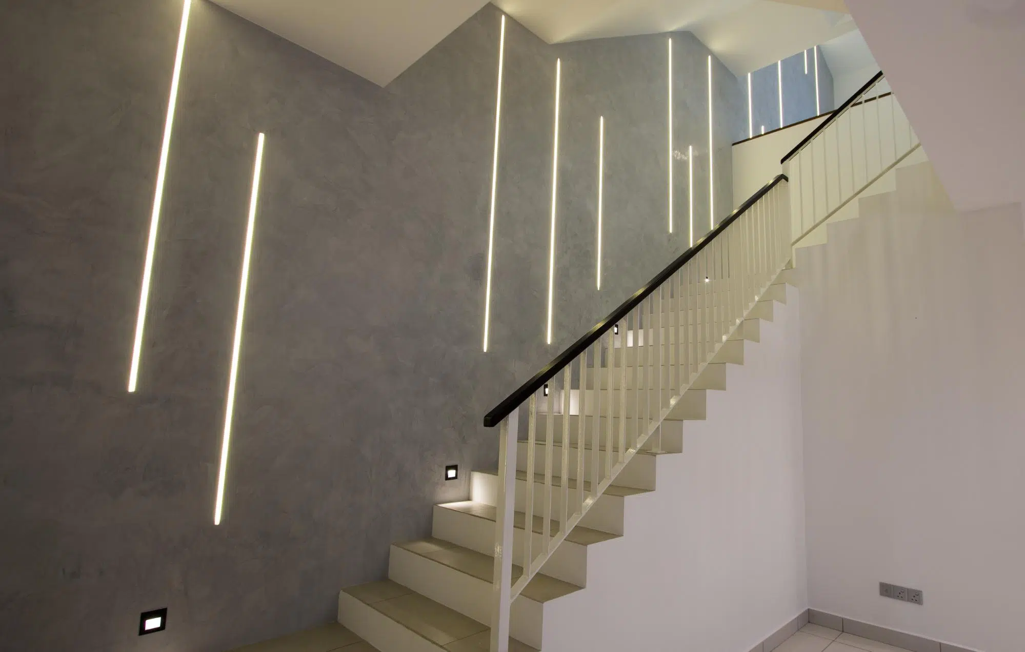 Modern industrial stairway feature wall with LED strip lights 