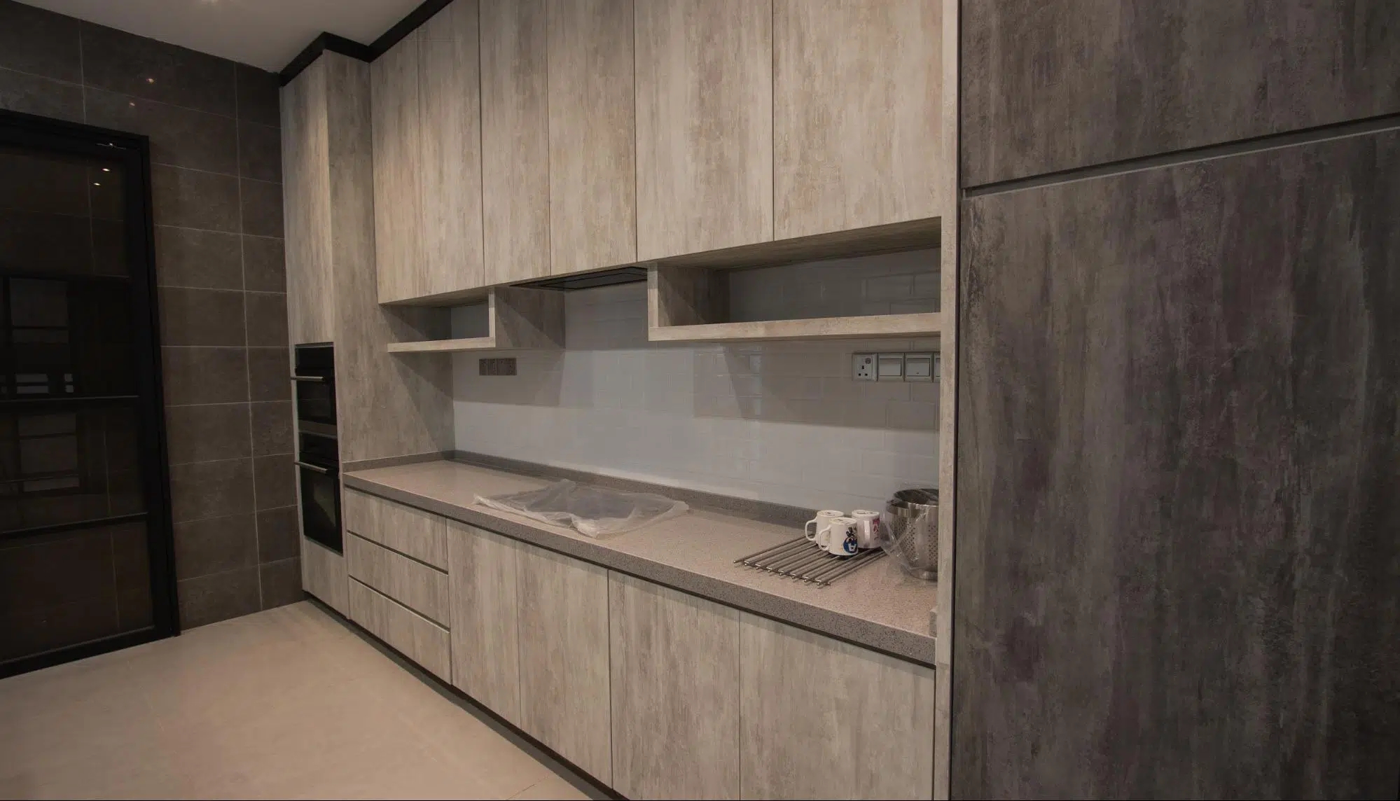 Dry kitchen cabinetry in grey modern industrial tones 