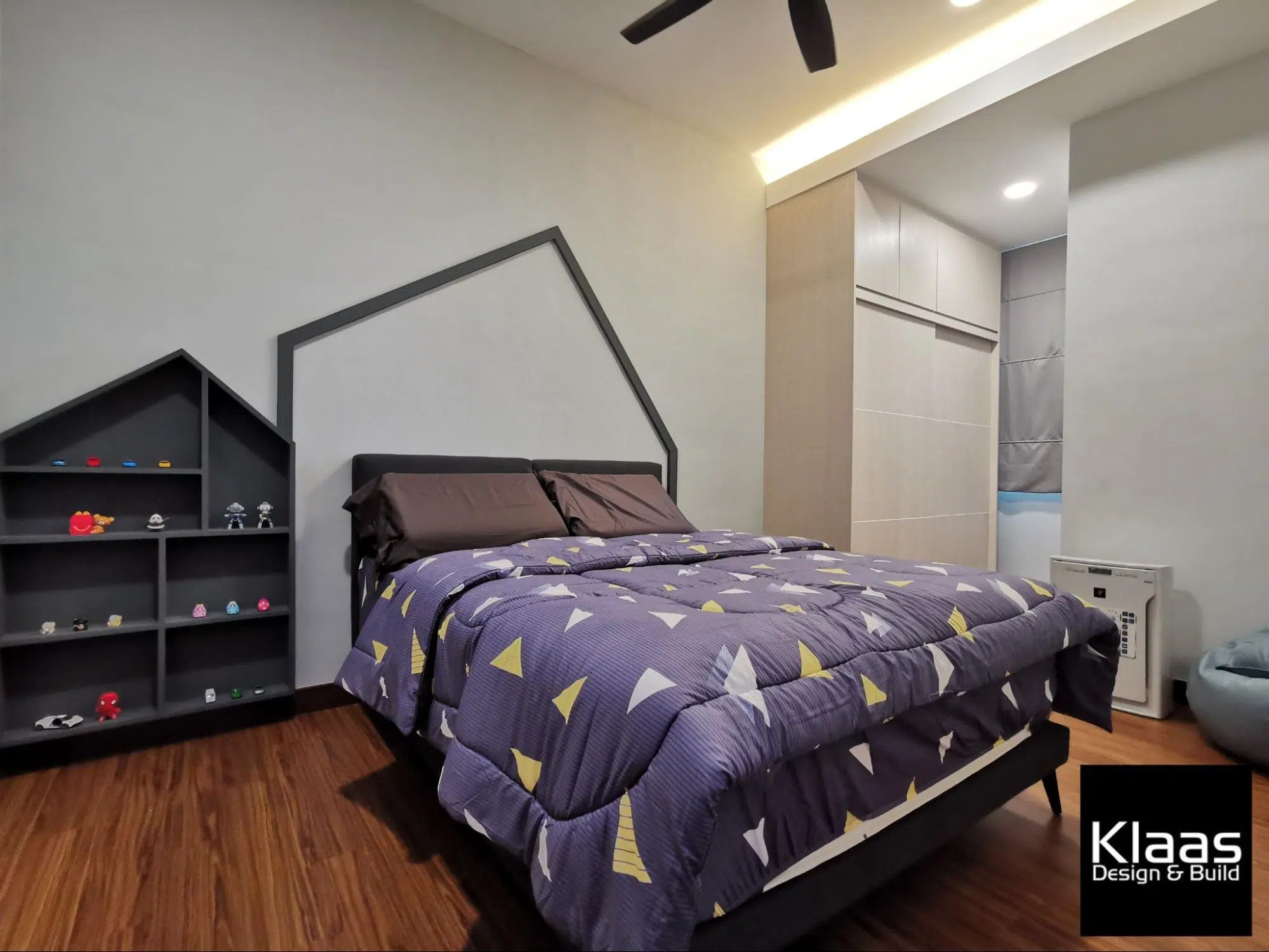 Boy's bedroom with custom made geometrical display shelf 