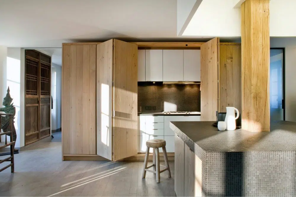 bi-fold wooden cabinet door to hide the kitchen counter when not in use