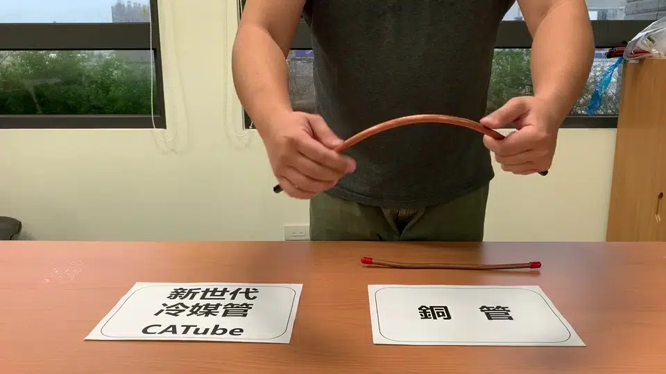 Above: A demonstration showing how CA Tube can be bent by hand to almost 90 degrees, unlike copper tubes which will deform and flatten. This makes it easier to install airconditioning units